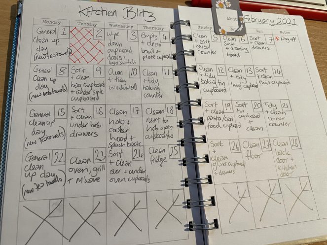 Image of notebook with handwritten cleaning plans on each day.