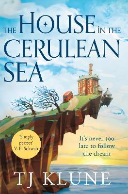 Image of the book cover for The House In The Cerulean Sea. A brick mansion stands on an overhanging cliff over a calm, blue sea at sunset. There is a red minibus and some windswept trees on the road leading up to the house, and white clouds in the sky. The tag line 'It's never too late to follow the dream' is written beneath the cliff.